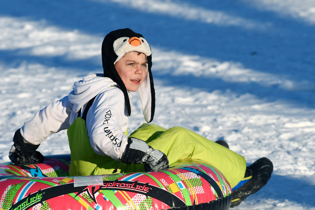 Boone Cyr, 9, looks into the sun